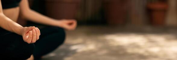 Cropped of lady in sportswear practicing yoga, meditates on street, enjoy peace and calm at free time, focus on hands, close up. Sports and body care, workout and active in city, copy space photo