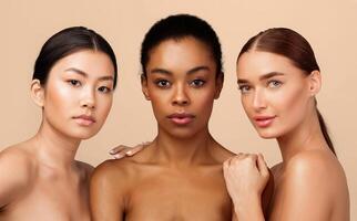 Three Sensual Multicultural Girls Posing Shirtless Standing Together On Gray Background. Studio Shot photo