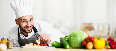 Chef Man Cooking Roasted Salmon Steak Plating Fish Dish Smiling At Camera Standing In Restaurant Kitchen. Selective Focus photo