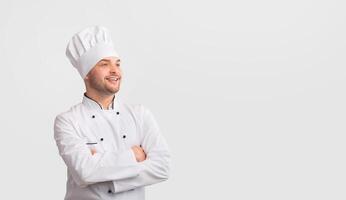 Successful Chef. Confident Cook Man Crossing Hands Looking At Copy Space Standing Over White Studio Background. Panorama photo