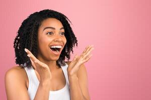 Big Sale Concept. Panorama of surprised african woman staring at copy space over isolated white studio background photo