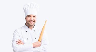 Cheerful Baker Man Holding Dough Rolling Pin Smiling To Camera Standing On White Studio Background. Pastry Recipes. Panorama. photo