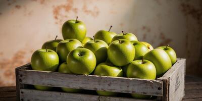 Fresh green apples in wooden crate on rustic background. photo