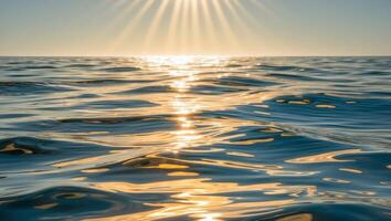 Sun shining over the ocean with waves photo