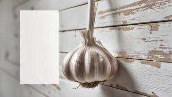 Close up monochromatic image with garlic hanging on a wall featuring ample copy space. photo