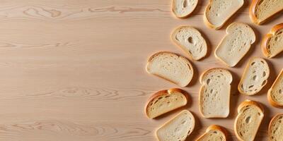 Wooden background holding sliced bread creating a copy space image. photo