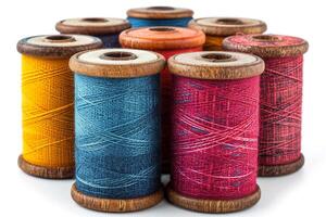 A spool of thread with different colors photo