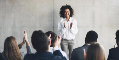 Business presentation. Grateful audience clapping hands to speaker after informative training photo