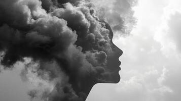 A silhouette of a woman emerges from dark, swirling clouds, blending with the sky. The image conveys deep thoughts and emotions, illustrating the connection between nature and human experience. photo