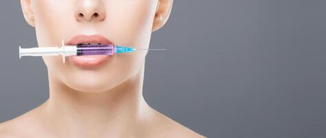 A woman with a syringe in her mouth, appearing to be in distress or experiencing a drug-related issue. The image captures a risky and concerning behavior that may have serious health implications. photo