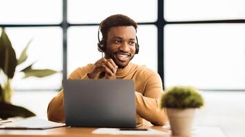 Hotline Support Service. Black operator in headset working in call center, panorama, copyspace photo