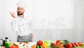 Great Recipe. Happy Chef Man Gesturing Approving Taste Looking At Camera Standing In Restaurant Kitchen. Selective Focus photo