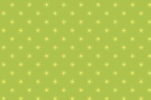 Pattern with snowflakes on a green background. vector