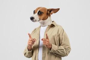 A dog with a whimsical expression stands confidently on its hind legs, wearing a casual shirt. It playfully points its paws as if mimicking a playful gesture photo