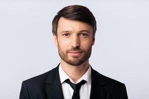 ID Photo. Portrait Of Businessman In Suit Looking Friendly At Camera Over White Background. Studio Shot, Isolated photo