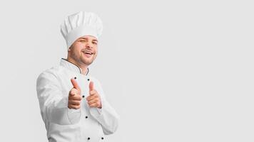 Hey, You. Cook Guy Pointing Fingers At Camera And Winking Posing Over White Background In Studio. Panorama photo