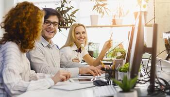Diverse Professionals Working Together in Office. A group of diverse young professionals actively collaborating at a bright, contemporary office, buzzing with teamwork and creativity. photo