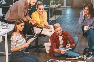 Creative people workplace. Young designers working together with color palettes in office photo