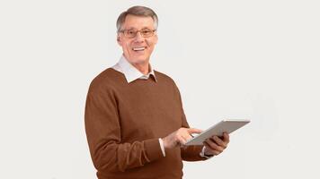 Great App. Happy Elderly Man Using Digital Tablet Smiling At Camera Standing Over White Background. Studio Shot, Panorama photo