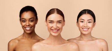 Three Happy Diverse Girls Wrapped In White Towels Posing Standing On Gray Studio Background, Smiling To Camera. Body Care Concept photo