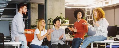 Group multiethnic business people applauding to new member of team with happy action in modern workplace, panorama photo