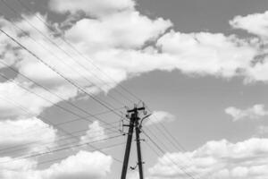 Power electric pole with line wire on light background close up photo
