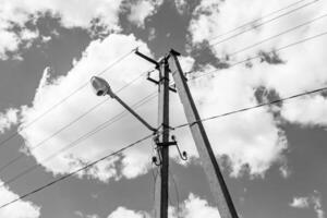 Power electric pole with line wire on light background close up photo
