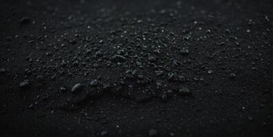 A close up of a black substance on a surface photo