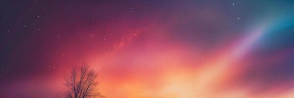 The aurora borealis over the mountains in the night sky photo