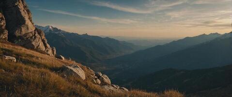 A mountain range with grass and rocks photo