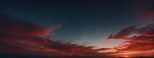 A red sky with clouds and stars photo