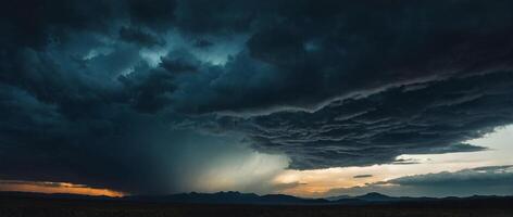 A storm is seen over the mountains in the background photo