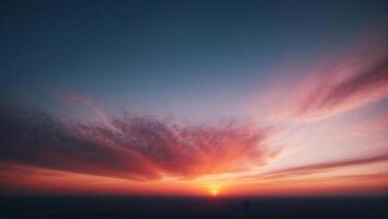 A sunset over a city with clouds in the sky photo
