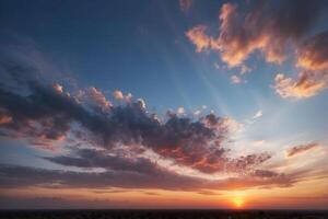 A sunset over a field with clouds and trees photo