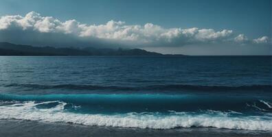 A blue ocean with waves and clouds photo