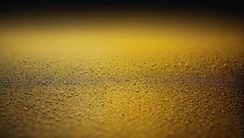 Raindrops on a glass surface with a yellow background photo