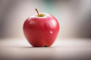 A red apple sitting on a table photo