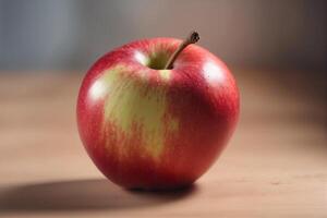 A red apple sitting on a table photo