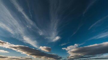 A view of the sky with clouds and a blue sky photo