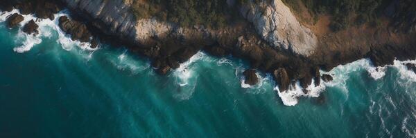 An aerial view of the ocean and cliffs photo