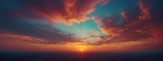 A sunset over a city with clouds in the sky photo