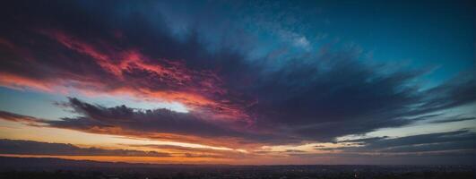 A colorful sunset over the city with clouds photo