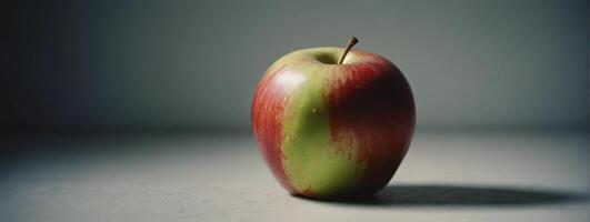 A red apple sitting on a table photo
