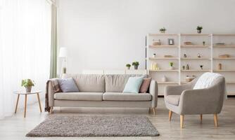 Cozy scandinavian style and modern design at home. Retro armchair and sofa, soft carpet, shelf with accessories and large window with daylight in living room interior, flat lay, panorama, free space photo