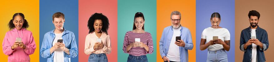 A diverse group of individuals, both young and older, are engaged with their smartphones while standing in front of vibrant, multicolored backgrounds photo
