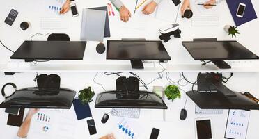 Just work. Young team working on computers at modern office, top view photo