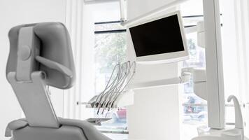 Shot of empty modern dentist workstation in dental cabinet photo