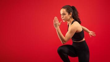 A woman wearing black top and leggings is practicing yoga poses outdoors. She is focused and balanced, engaging in a series of stretches and postures to promote flexibility and strength, copy space photo