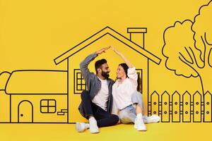 Diverse man and a woman couple are sitting on the ground in front of a house. They appear relaxed and engaged in conversation, with the house as a backdrop. photo