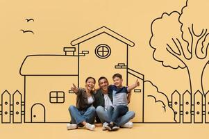 Adorable black family is seated on the ground, facing a life-sized drawing of a house. They appear engaged, possibly discussing or admiring the artwork. photo